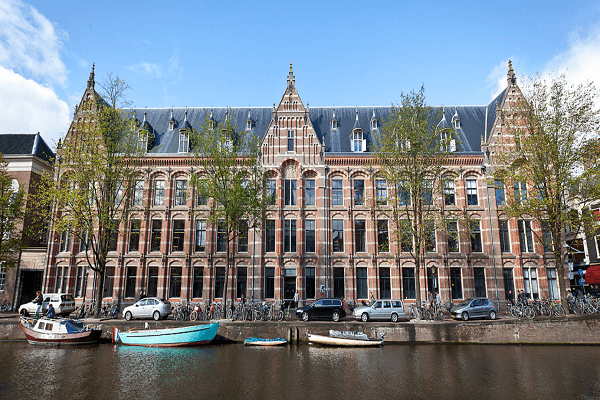 Iconic Amsterdam canal view, symbolizing the city's blend of historic charm and academic vibrancy
