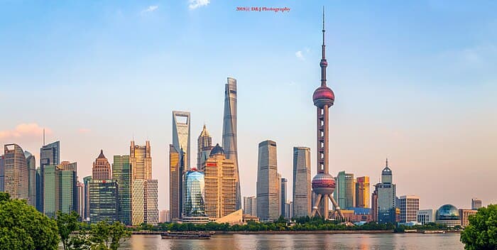Aerial view of Shanghai's university campuses, showcasing the modern educational infrastructure against the city skyline