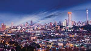 The Johannesburg skyline with prominent university buildings, symbolizing the city's commitment to higher education and its role as a leading academic center in South Africa.