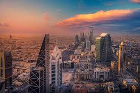 The skyline of Riyadh at dusk, showcasing the modern architecture of its universities and colleges, reflecting the city's commitment to becoming a global leader in education and research.