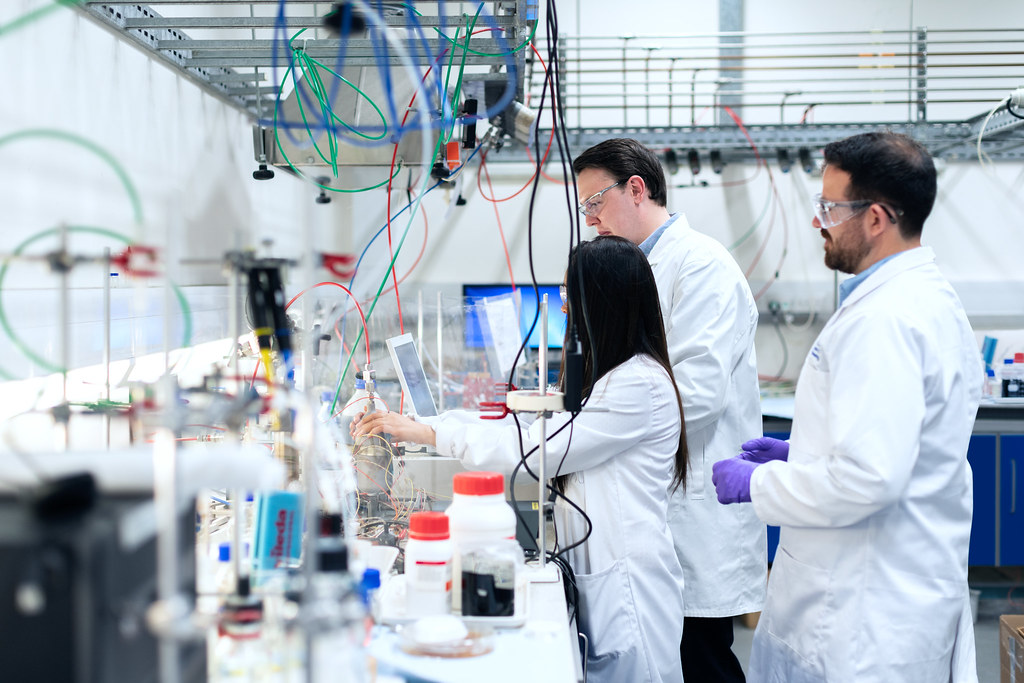 An image showcasing a chemical engineer at work in a lab, surrounded by advanced equipment, highlighting the blend of science and technology in the field